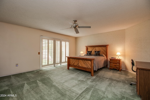 carpeted bedroom with access to outside, a textured ceiling, and ceiling fan