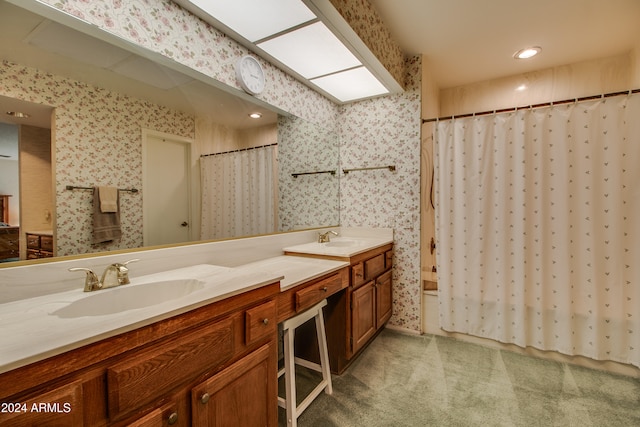 bathroom with walk in shower and vanity