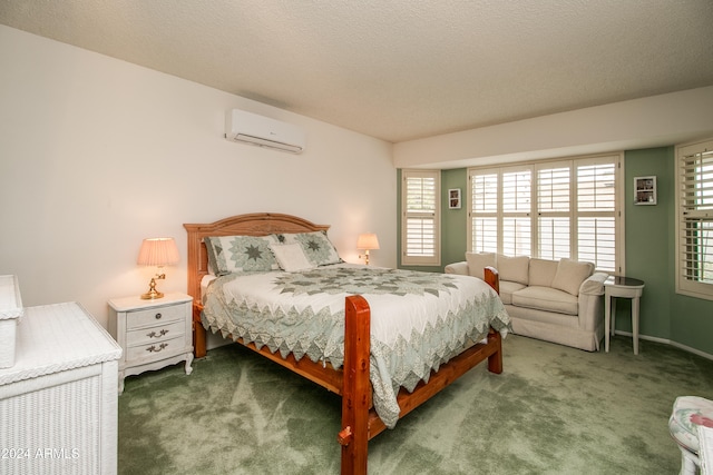 bedroom with a wall mounted AC, carpet floors, and a textured ceiling