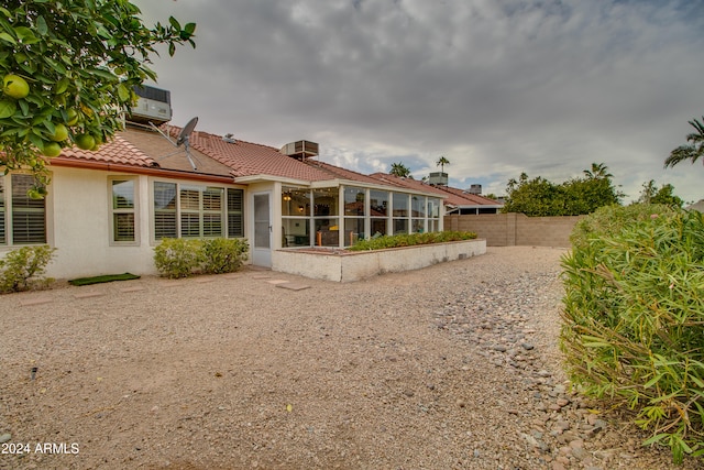 rear view of house with a sunroom