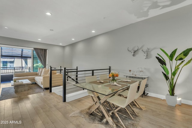 dining space with light wood-type flooring