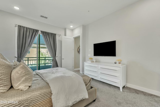 bedroom featuring access to exterior and light colored carpet