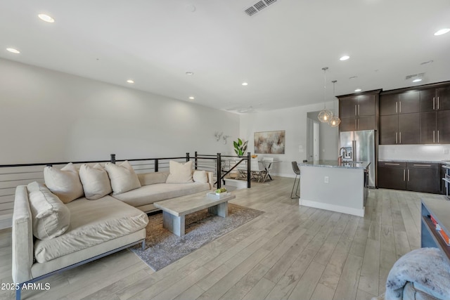 living room with light hardwood / wood-style floors