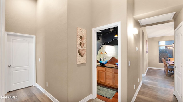 hall with light hardwood / wood-style floors