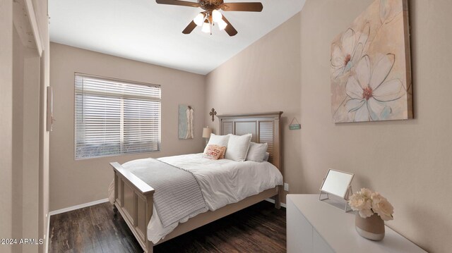 bedroom featuring ceiling fan and dark hardwood / wood-style floors