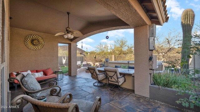 view of patio / terrace featuring ceiling fan