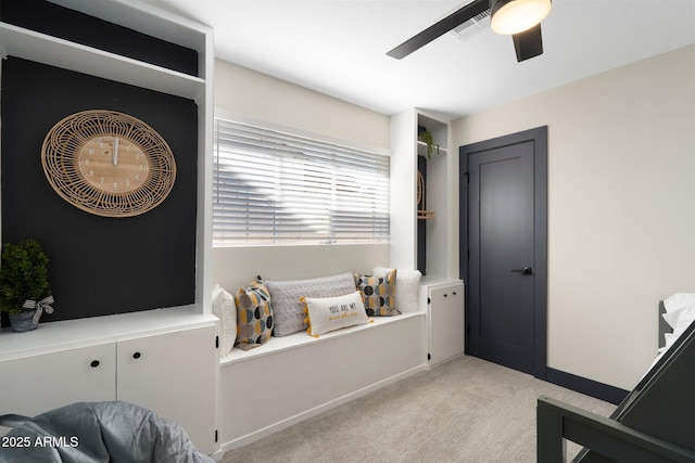 bathroom featuring ceiling fan and baseboards