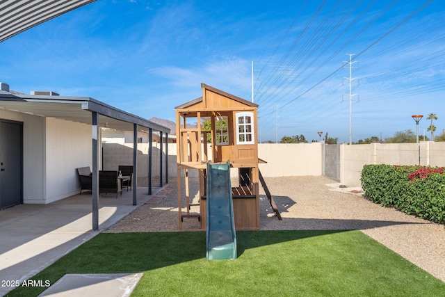 view of jungle gym featuring a patio area