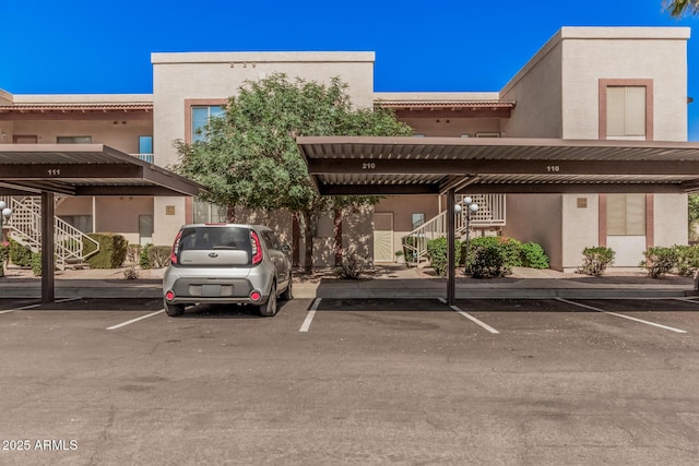 205 N 74th St Unit 110, Mesa, AZ 85207 - view of building exterior with stairway and covered parking