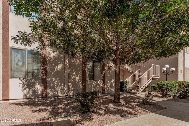 205 N 74th St Unit 110, Mesa, AZ 85207 - view of side of property with stairway and stucco siding