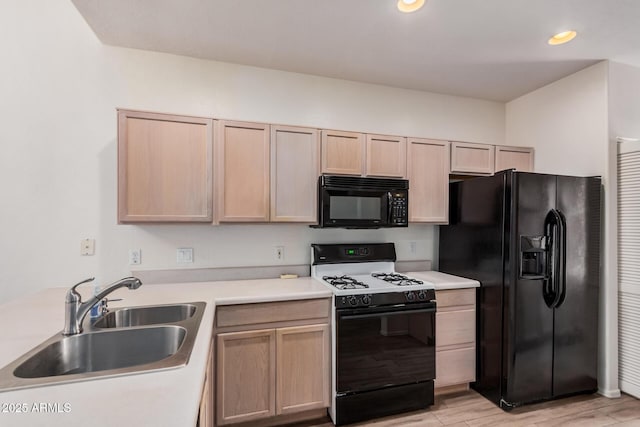 205 N 74th St Unit 110, Mesa, AZ 85207 - kitchen with black appliances, light brown cabinets, light wood-type flooring, light countertops, and recessed lighting