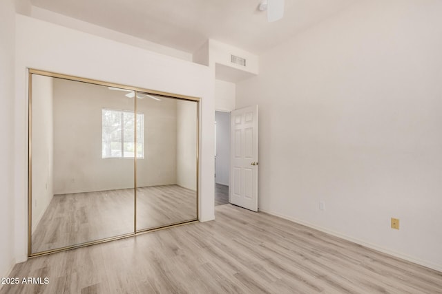 205 N 74th St Unit 110, Mesa, AZ 85207 - unfurnished bedroom with wood finished floors and a closet