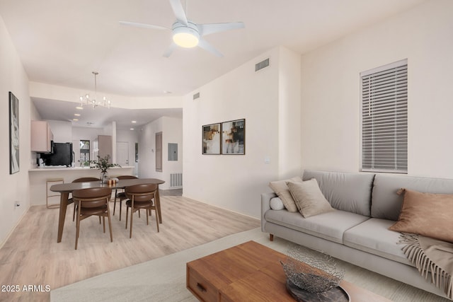 205 N 74th St Unit 110, Mesa, AZ 85207 - living area featuring light wood-type flooring, a chandelier, and ceiling fan