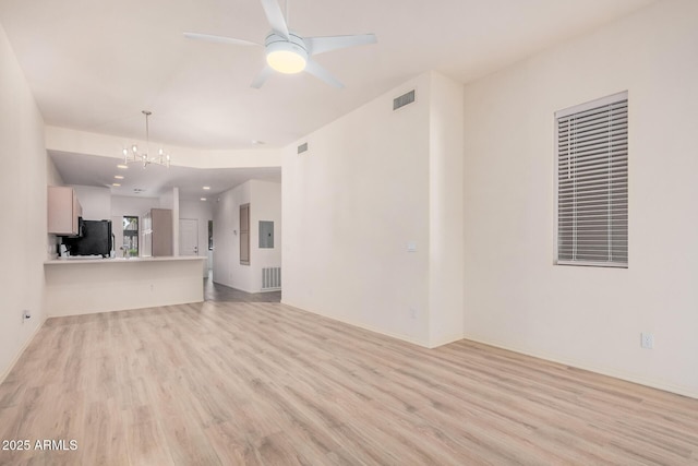 205 N 74th St Unit 110, Mesa, AZ 85207 - unfurnished living room featuring light wood-type flooring, a chandelier, and ceiling fan
