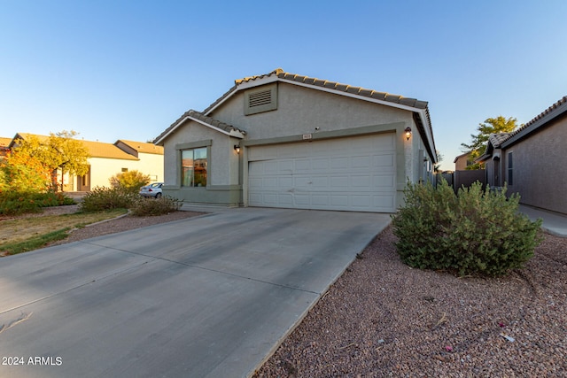 view of front of property with a garage