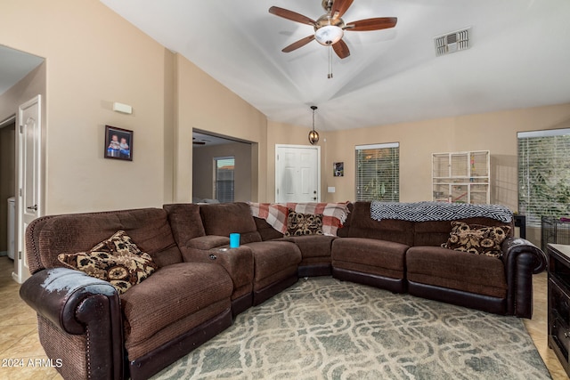 living room featuring light tile patterned floors, vaulted ceiling, and ceiling fan