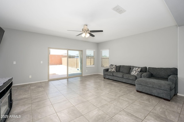 25951 W Piute Ave, Buckeye, AZ 85396 - living area with ceiling fan, light tile patterned flooring, and baseboards