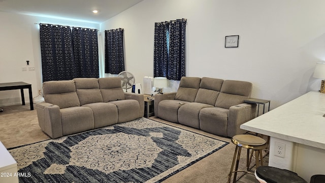 living room featuring vaulted ceiling and carpet