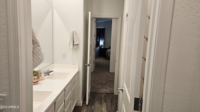 bathroom featuring vanity and hardwood / wood-style floors