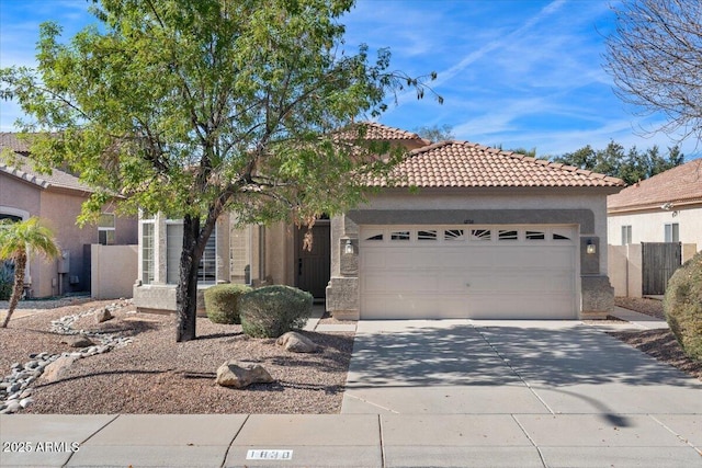 mediterranean / spanish-style home with a garage