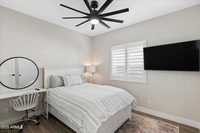 bedroom featuring dark wood-type flooring and ceiling fan