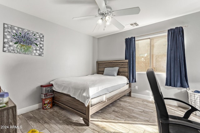 bedroom featuring light hardwood / wood-style flooring and ceiling fan