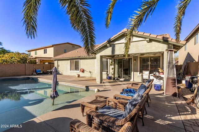 view of swimming pool with a patio