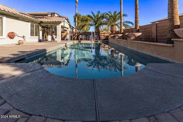 view of swimming pool featuring a patio