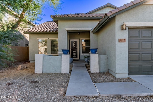 entrance to property featuring a garage