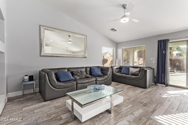 living room featuring light hardwood / wood-style flooring, ceiling fan, and lofted ceiling