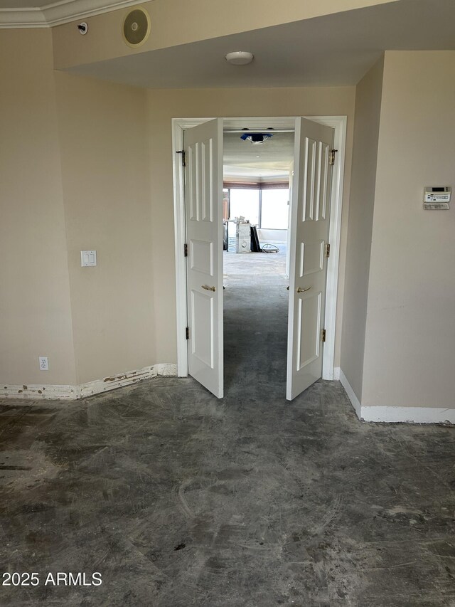 spare room featuring baseboards