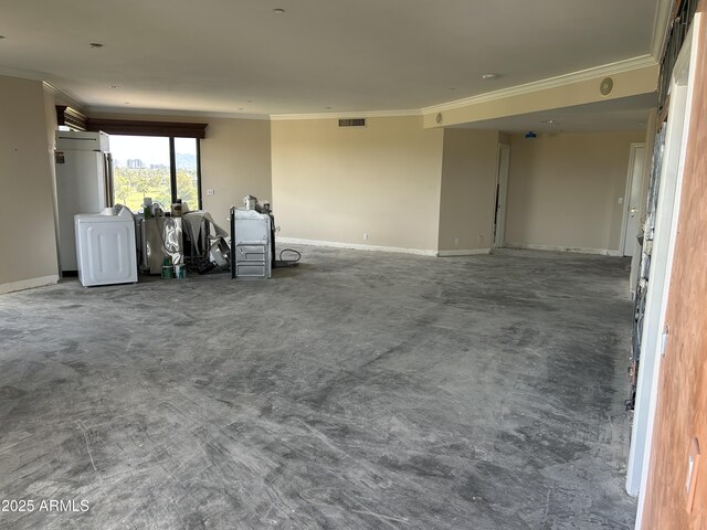 unfurnished living room featuring baseboards, ornamental molding, and visible vents