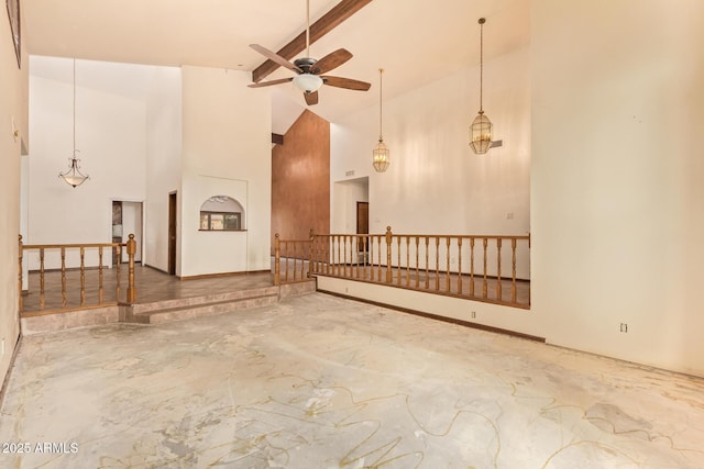 4922 W Fallen Leaf Ln, Glendale, AZ 85310 - unfurnished living room with ceiling fan, beamed ceiling, concrete flooring, and high vaulted ceiling