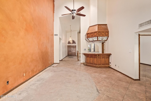 4922 W Fallen Leaf Ln, Glendale, AZ 85310 - corridor featuring a towering ceiling, baseboards, and tile patterned flooring