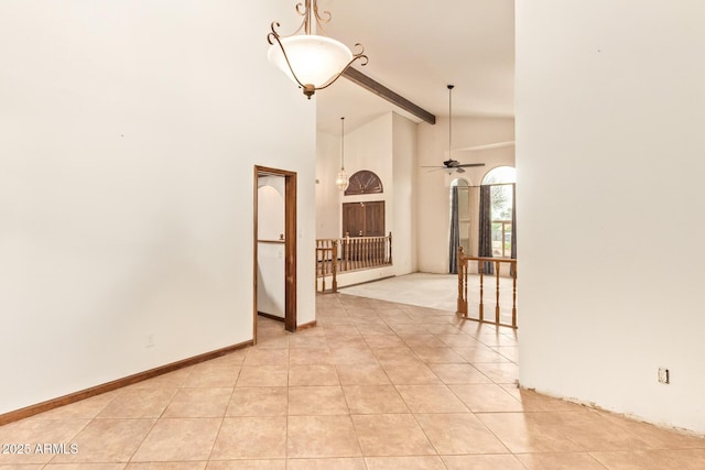 4922 W Fallen Leaf Ln, Glendale, AZ 85310 - empty room with light tile patterned flooring, high vaulted ceiling, beamed ceiling, and ceiling fan