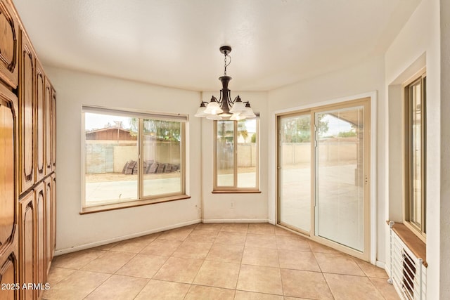 4922 W Fallen Leaf Ln, Glendale, AZ 85310 - unfurnished sunroom featuring plenty of natural light and a chandelier