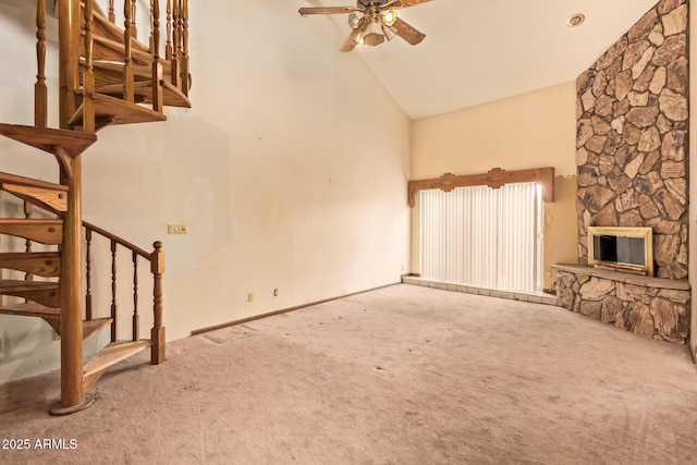4922 W Fallen Leaf Ln, Glendale, AZ 85310 - unfurnished living room featuring carpet, high vaulted ceiling, stairway, a ceiling fan, and a stone fireplace