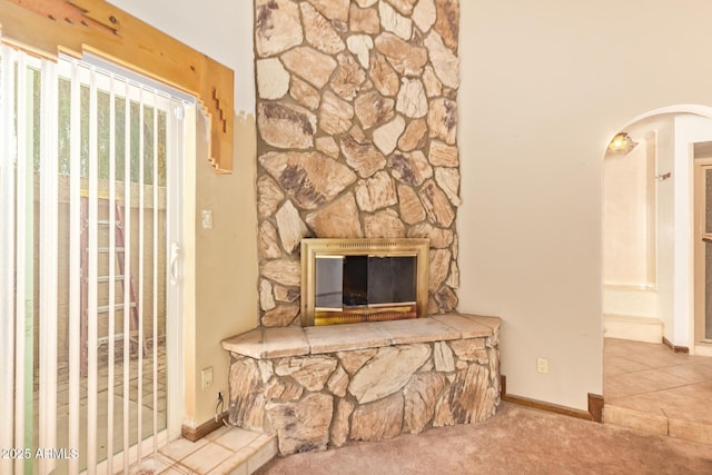 4922 W Fallen Leaf Ln, Glendale, AZ 85310 - unfurnished living room with arched walkways, carpet floors, and baseboards
