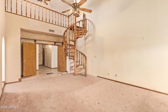 4922 W Fallen Leaf Ln, Glendale, AZ 85310 - unfurnished living room with carpet floors, stairway, a high ceiling, ceiling fan, and baseboards