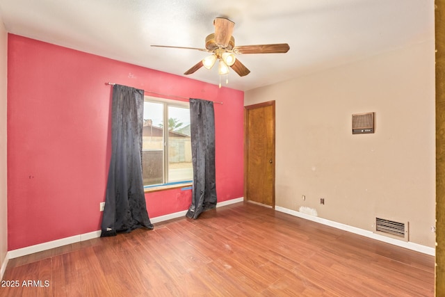 4922 W Fallen Leaf Ln, Glendale, AZ 85310 - spare room featuring wood finished floors, a ceiling fan, and baseboards