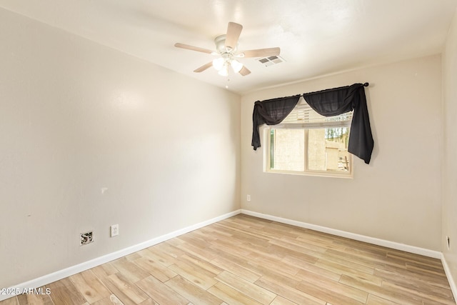 4922 W Fallen Leaf Ln, Glendale, AZ 85310 - spare room with a ceiling fan, wood finished floors, and baseboards