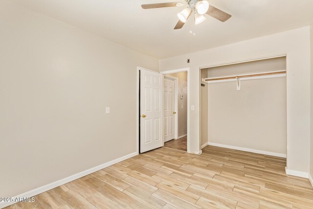 4922 W Fallen Leaf Ln, Glendale, AZ 85310 - unfurnished bedroom with light wood finished floors, baseboards, a closet, and ceiling fan
