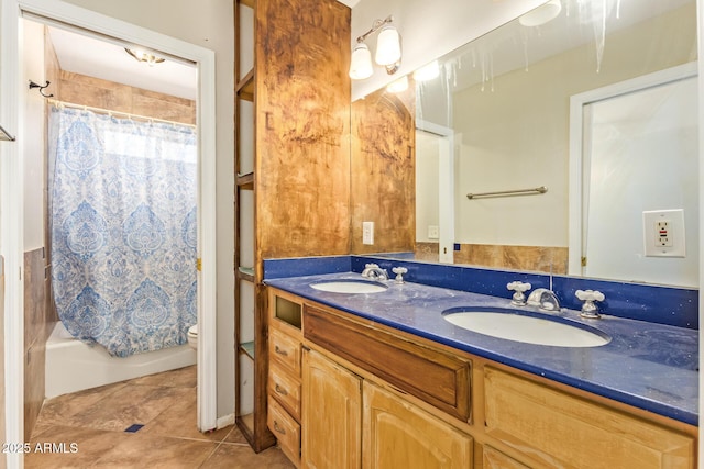 4922 W Fallen Leaf Ln, Glendale, AZ 85310 - full bath with double vanity, toilet, tile patterned flooring, and shower / bathtub combination with curtain