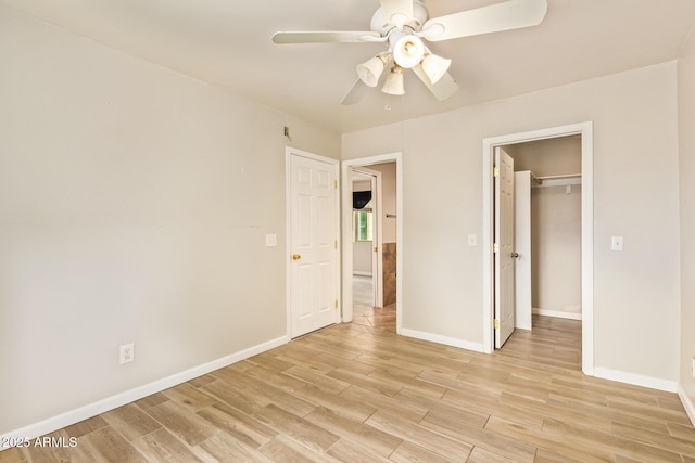 4922 W Fallen Leaf Ln, Glendale, AZ 85310 - unfurnished bedroom with light wood-type flooring, baseboards, and a ceiling fan