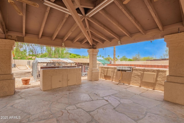 4922 W Fallen Leaf Ln, Glendale, AZ 85310 - fenced backyard featuring an outdoor kitchen and a patio area