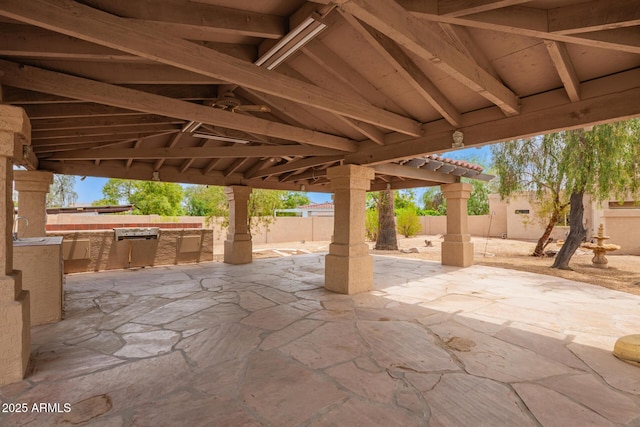 4922 W Fallen Leaf Ln, Glendale, AZ 85310 - fenced backyard featuring a patio area, an outdoor kitchen, and a sink