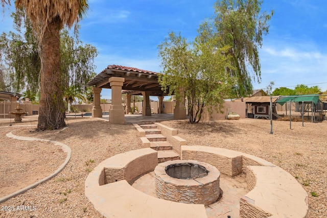 4922 W Fallen Leaf Ln, Glendale, AZ 85310 - view of yard featuring a gazebo, an outdoor fire pit, and a patio area