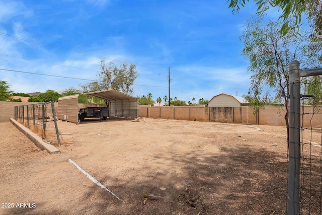 4922 W Fallen Leaf Ln, Glendale, AZ 85310 - view of yard featuring driveway and a detached carport