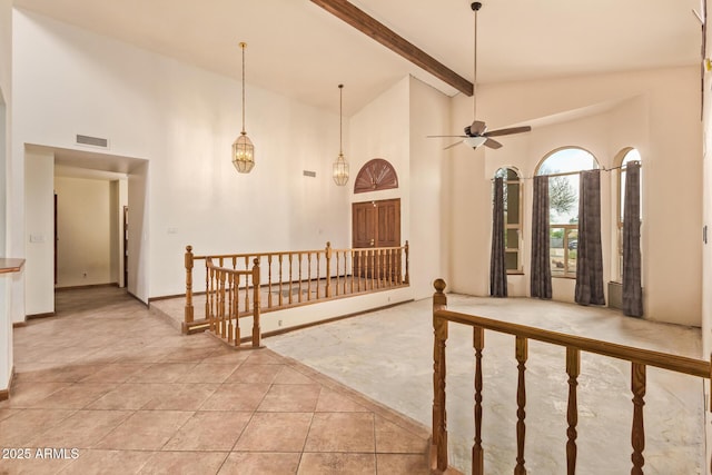 4922 W Fallen Leaf Ln, Glendale, AZ 85310 - foyer entrance featuring high vaulted ceiling, a ceiling fan, light tile patterned floors, beamed ceiling, and baseboards