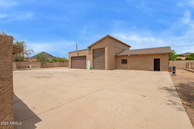 4922 W Fallen Leaf Ln, Glendale, AZ 85310 - garage featuring driveway and central AC